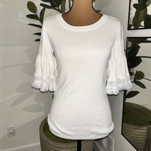 White sweater top with wide short sleeves with fringe detail